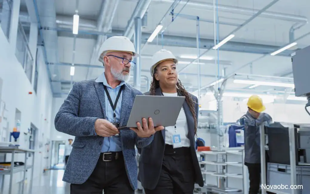 Logistics managers coordinating production in advanced manufacturing plant Logistics managers coordinating production in advanced manufacturing plant