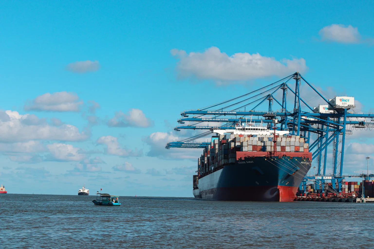 Container ship alongside a port terminal.